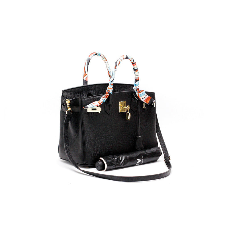Women's Leather Handbag with Multiple Pockets and Twist Lock Closure