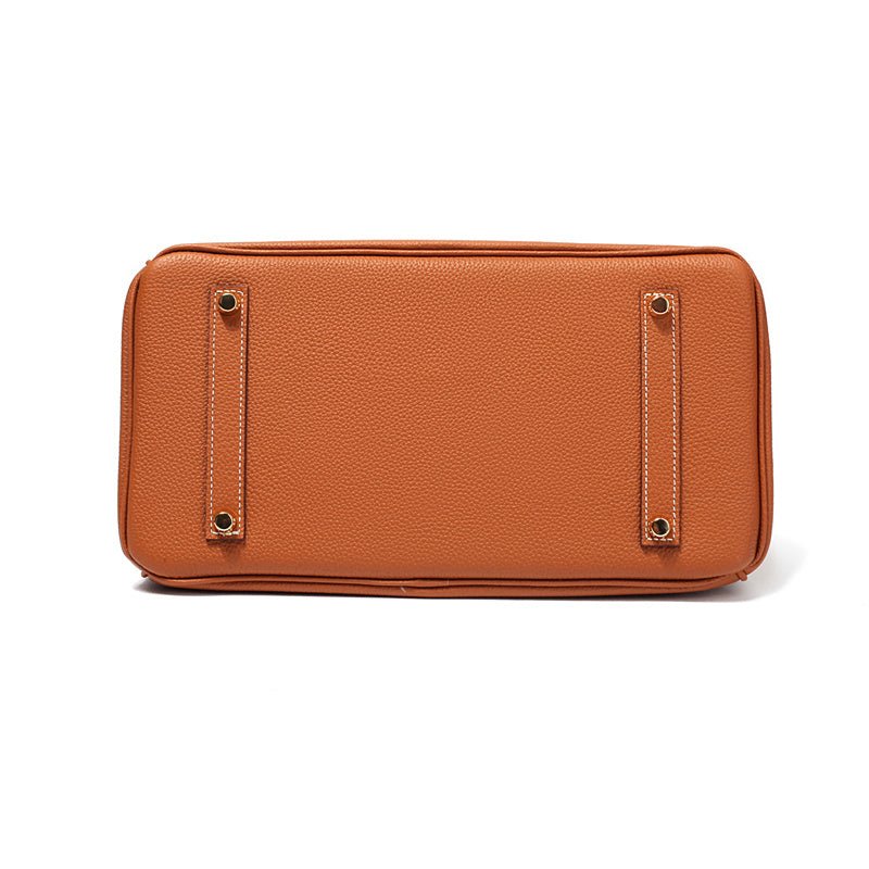 Women's Leather Handbag with Multiple Pockets and Twist Lock Closure