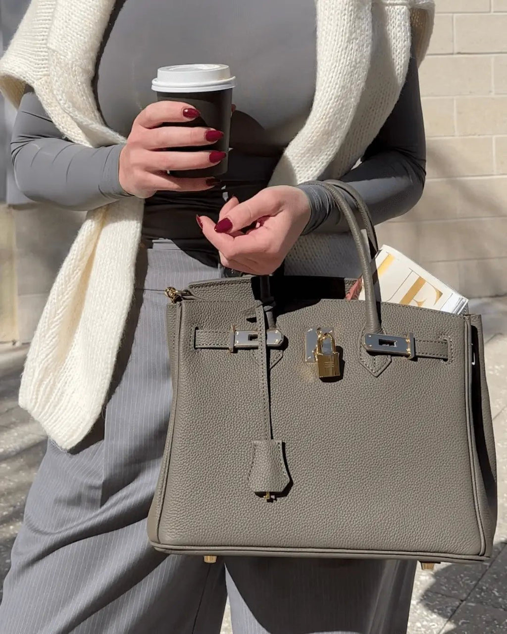 Women's Leather Handbag with Multiple Pockets and Twist Lock Closure