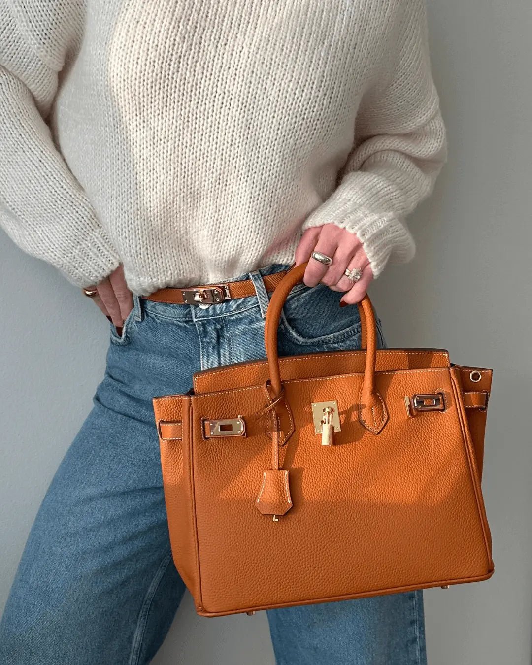 Women's Leather Handbag with Multiple Pockets and Twist Lock Closure