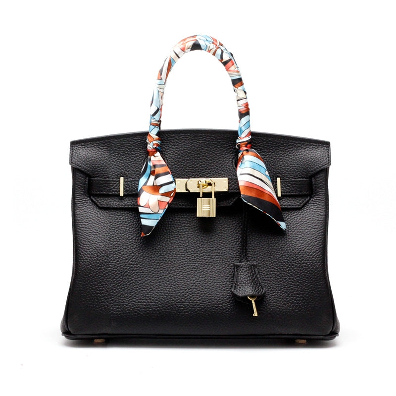 Women's Leather Handbag with Multiple Pockets and Twist Lock Closure