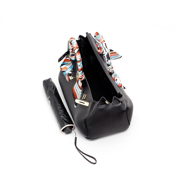 Women's Leather Handbag with Multiple Pockets and Twist Lock Closure