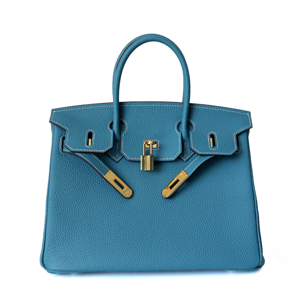 Women's Leather Handbag with Multiple Pockets and Twist Lock Closure